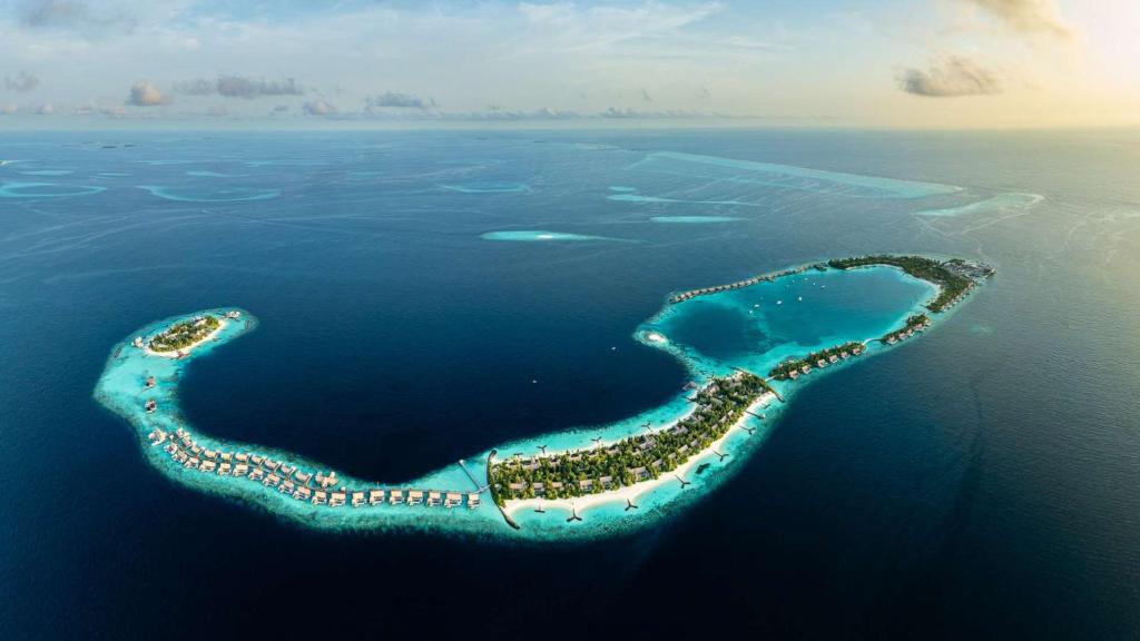 an island in the middle of the ocean at Waldorf Astoria Maldives Ithaafushi in South Male Atoll