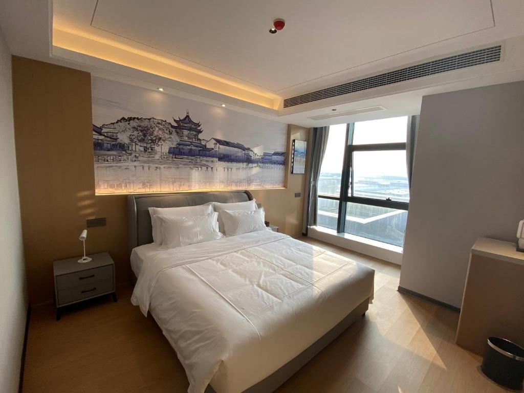 Fotografie z fotogalerie ubytování Yilong Michael International Hotel Suzhou Industrial Park Nanhuanqiao Market Branch v destinaci Jiangtian