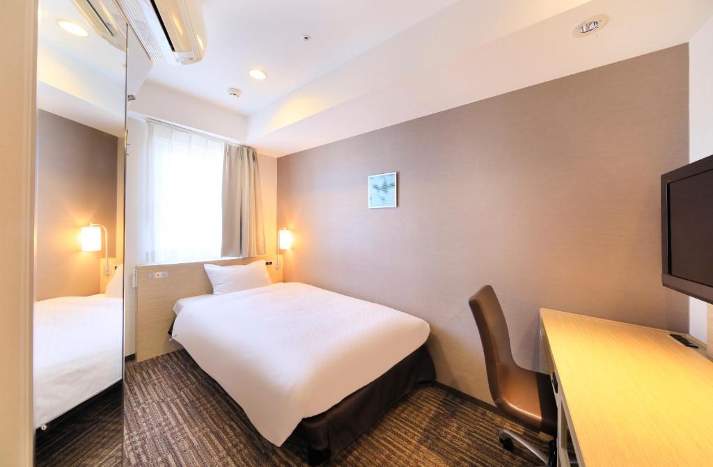 Postel nebo postele na pokoji v ubytování Via Inn Akihabara