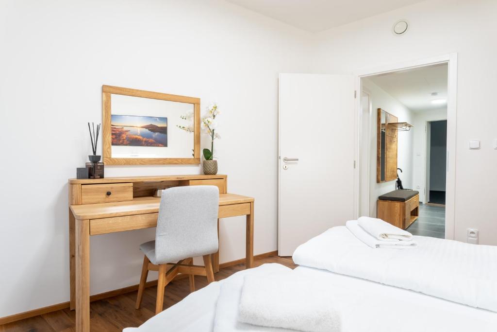 Postel nebo postele na pokoji v ubytování Apartmány Resort Vrchlabí