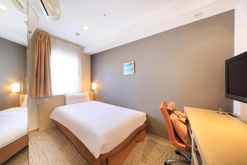 Postel nebo postele na pokoji v ubytování Via Inn Akihabara