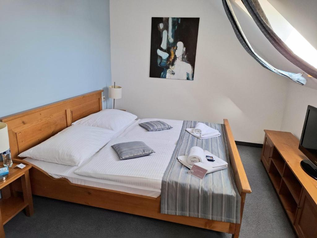 Postel nebo postele na pokoji v ubytování Hotel Peklo