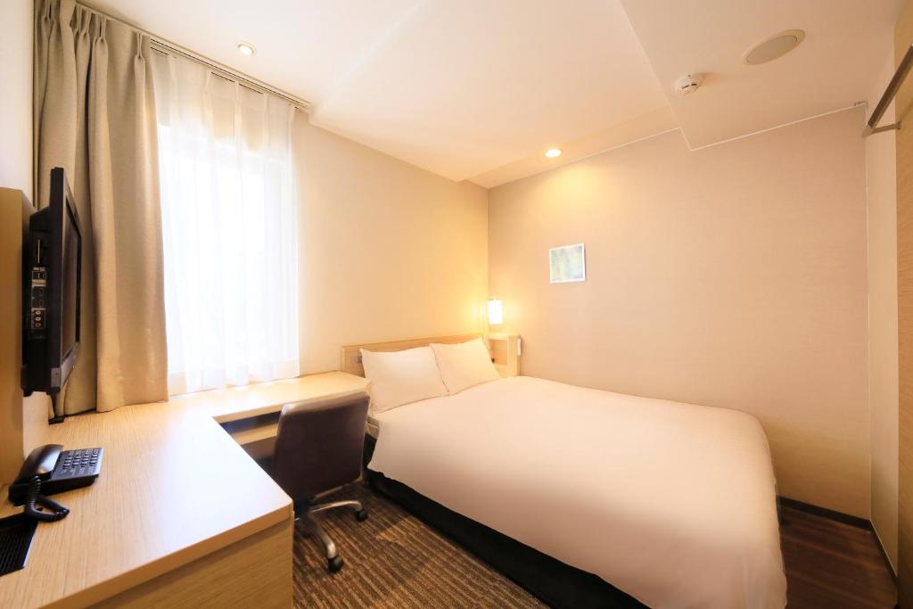 Postel nebo postele na pokoji v ubytování Via Inn Akihabara