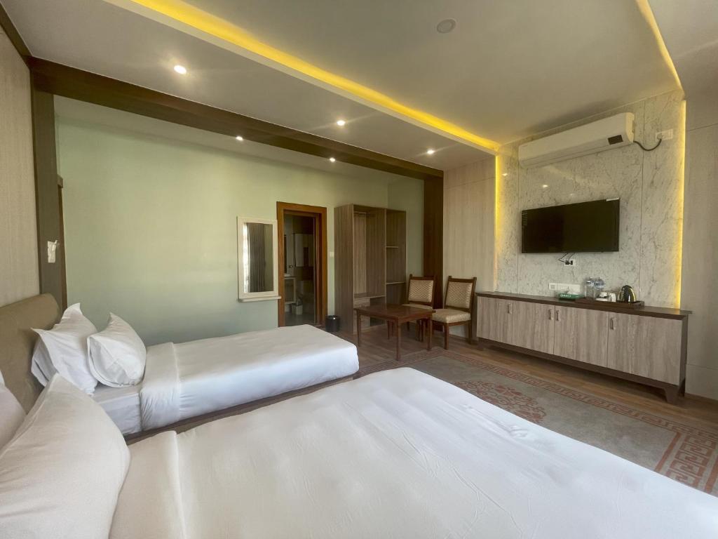 Postel nebo postele na pokoji v ubytování Hotel Bayberry Kathmandu - Near Tribhuvan International Airport