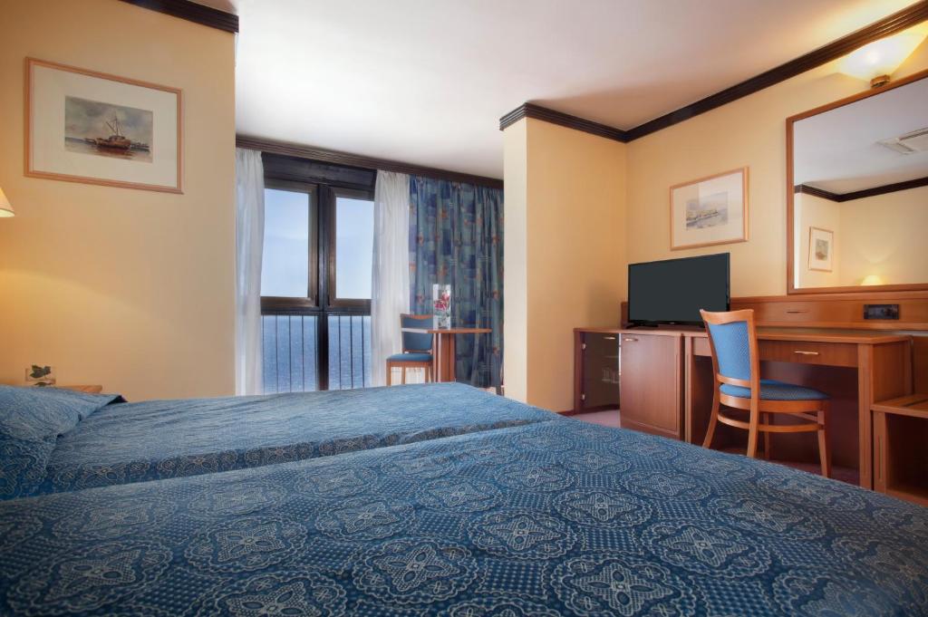 Posteľ alebo postele v izbe v ubytovaní Hotel Kristal - Liburnia