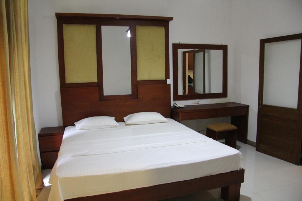 Postel nebo postele na pokoji v ubytování Sagala Bungalow