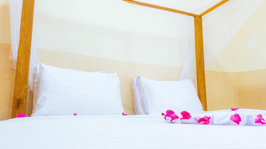 Postel nebo postele na pokoji v ubytování Sands Inn Hotel