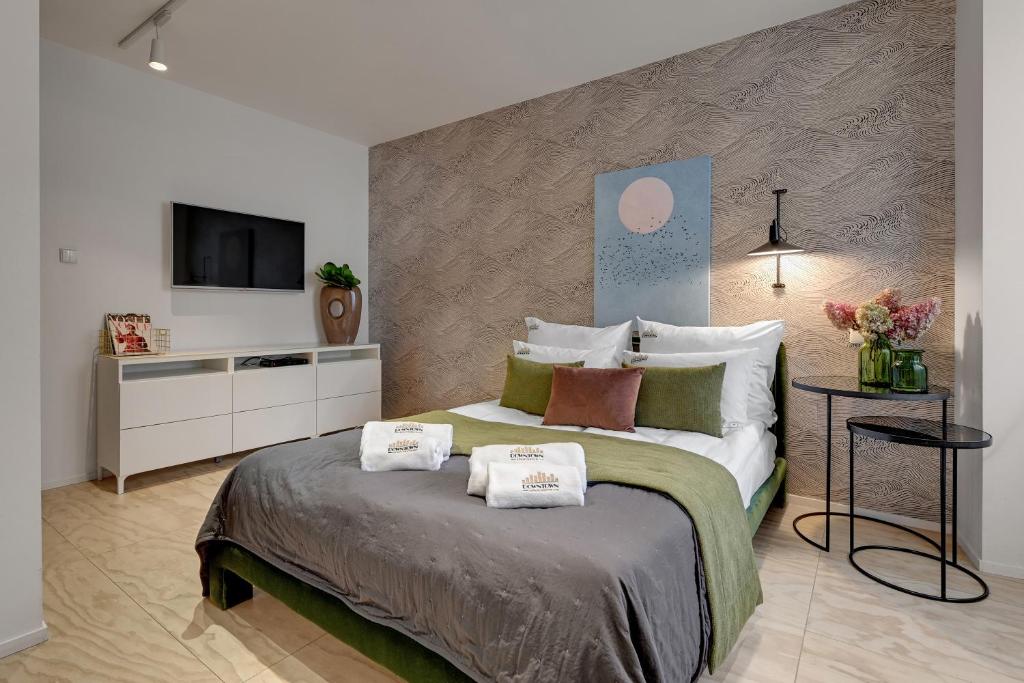 Posteľ alebo postele v izbe v ubytovaní Tartaczna City Center by Downtown Apartments