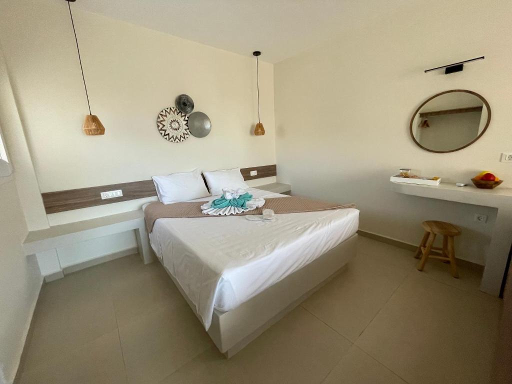 Postel nebo postele na pokoji v ubytování Tamaris Suites