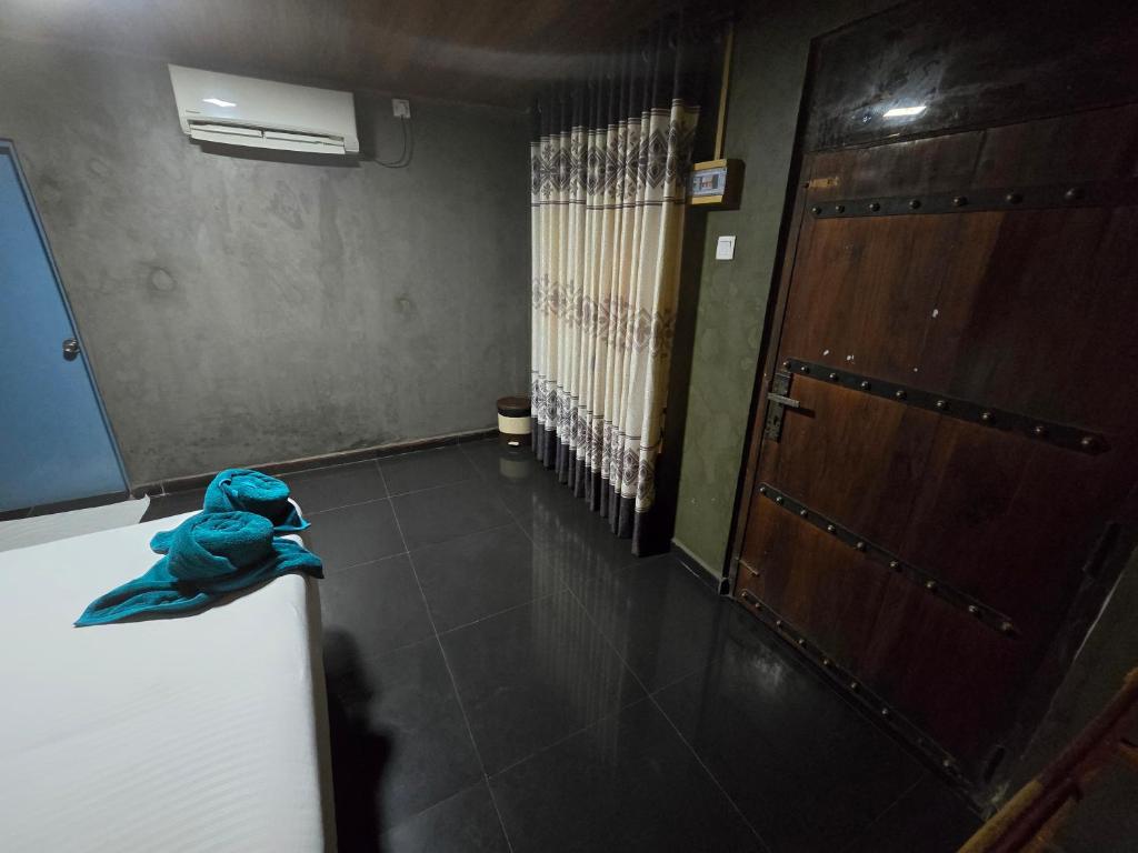 Postel nebo postele na pokoji v ubytování Ceylon wilpattu safaris & lodging