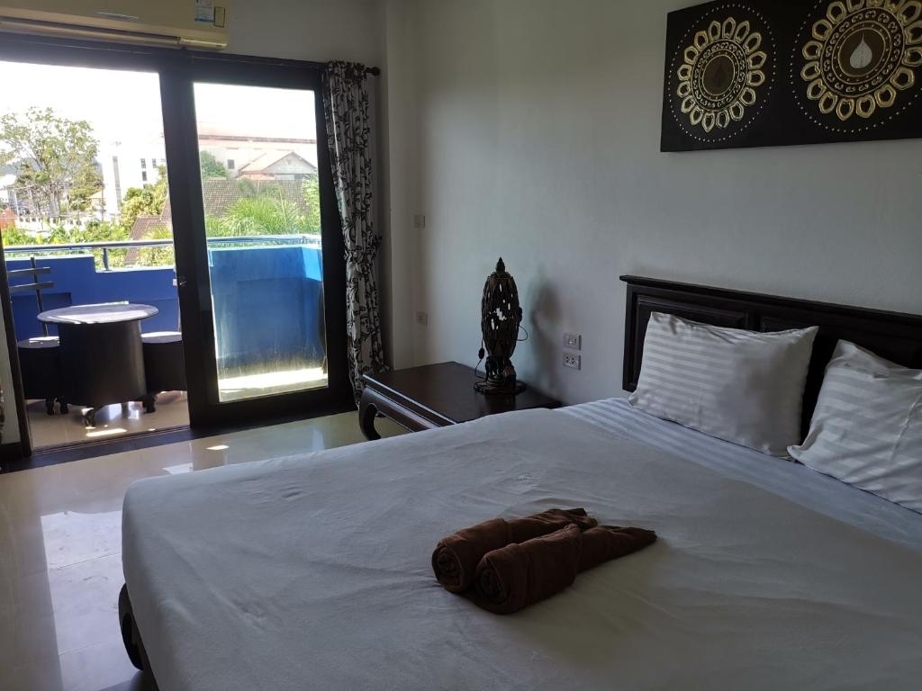 Postel nebo postele na pokoji v ubytování บ้านอันดามัน กระบี่