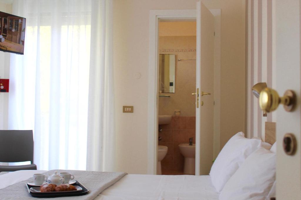 Postel nebo postele na pokoji v ubytování King Hotel