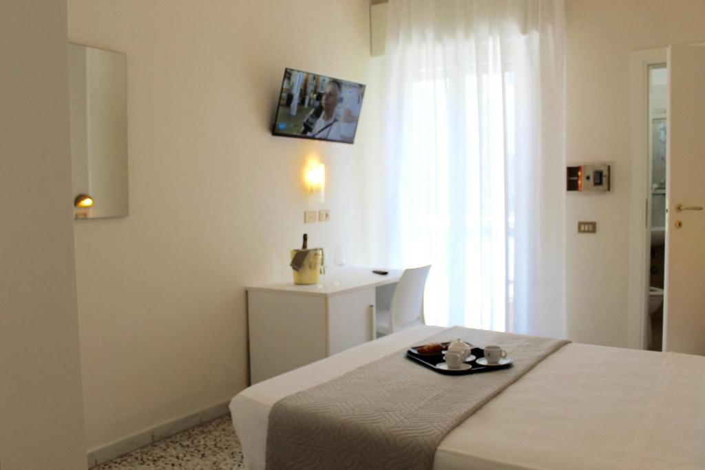 Postel nebo postele na pokoji v ubytování King Hotel