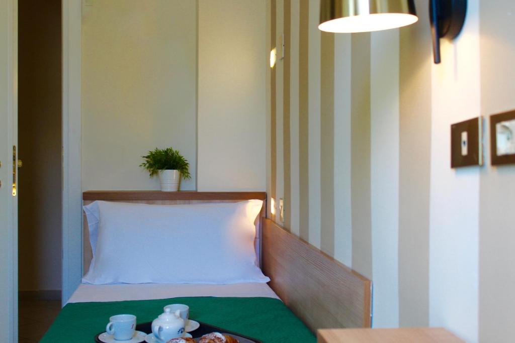 Postel nebo postele na pokoji v ubytování King Hotel