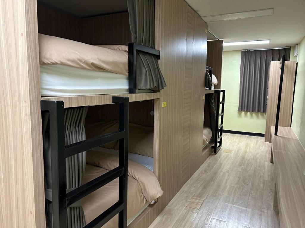 Postel nebo postele na pokoji v ubytování OD Hostel