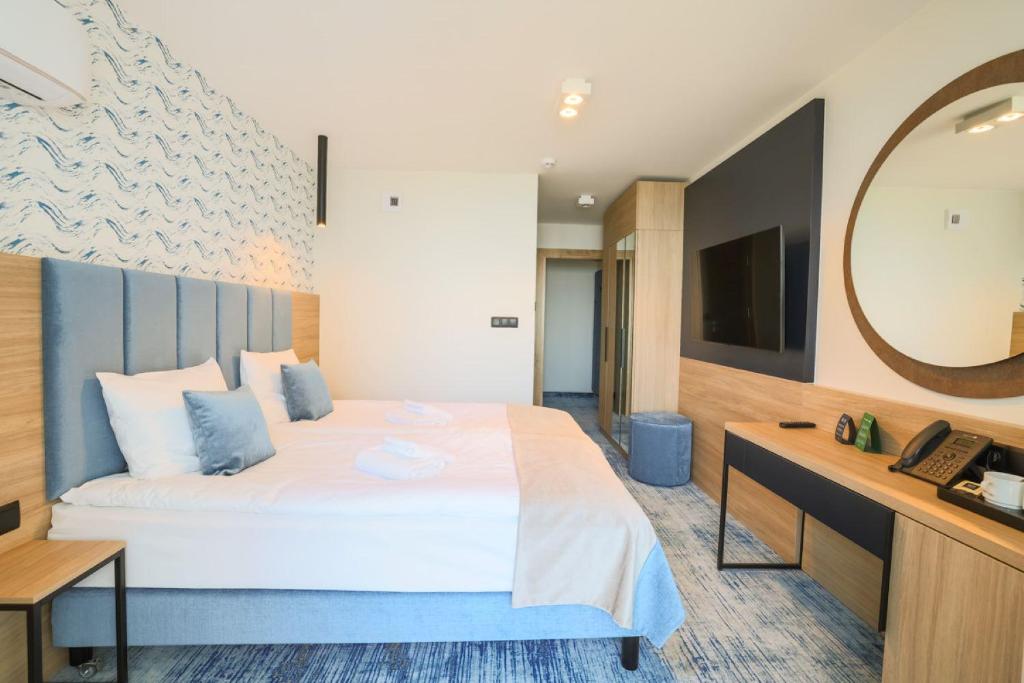 Postel nebo postele na pokoji v ubytování Porta Mare Active & Spa Resort