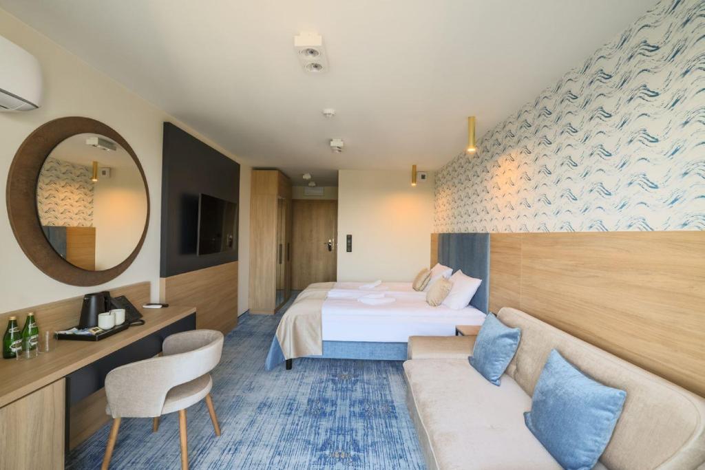 Postel nebo postele na pokoji v ubytování Porta Mare Active & Spa Resort