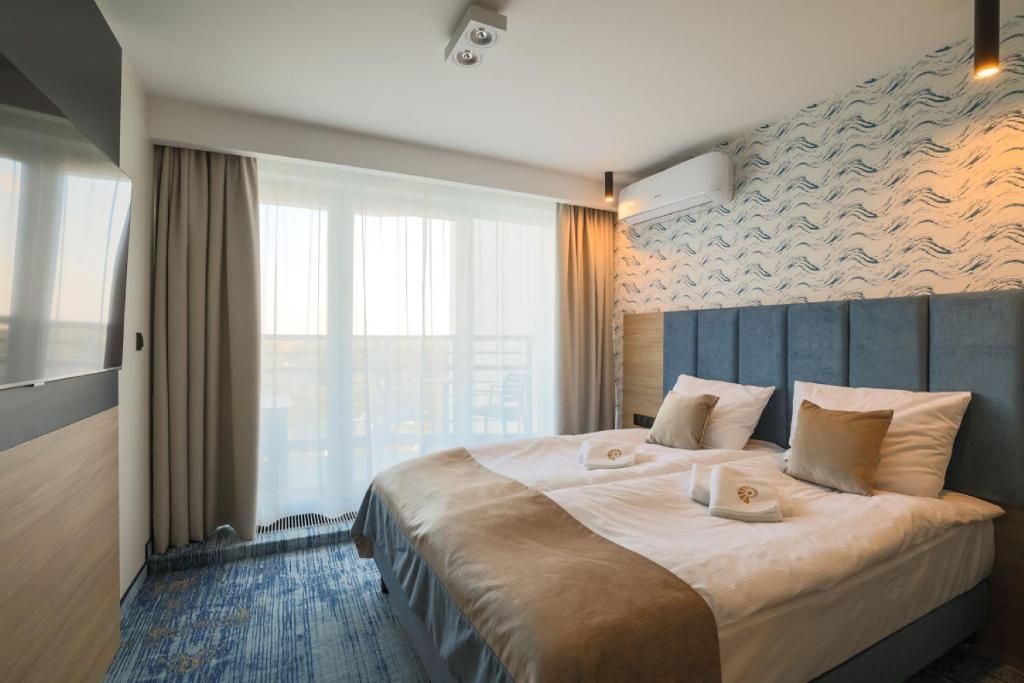 Postel nebo postele na pokoji v ubytování Porta Mare Active & Spa Resort