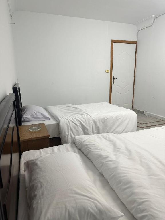 Postel nebo postele na pokoji v ubytování QinFu HOTEL