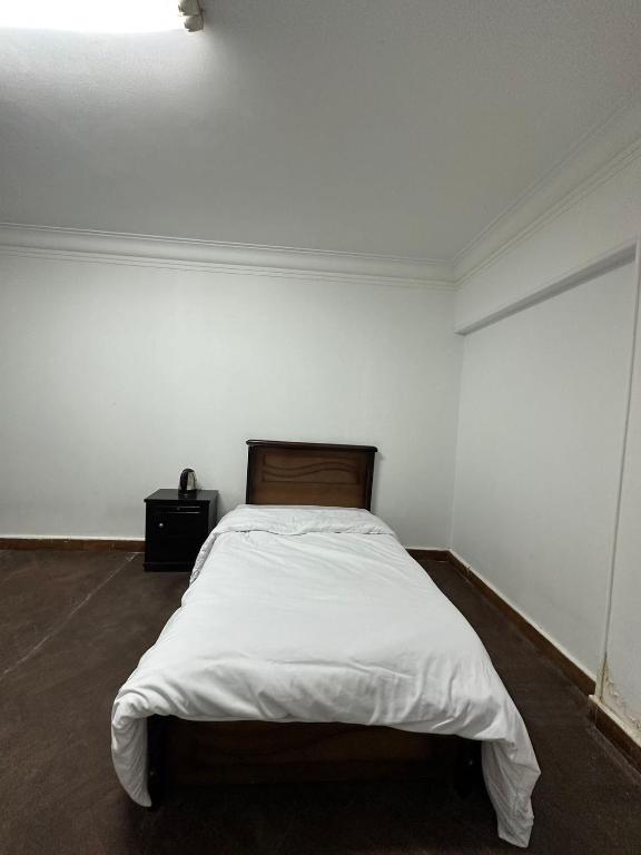 Postel nebo postele na pokoji v ubytování QinFu HOTEL