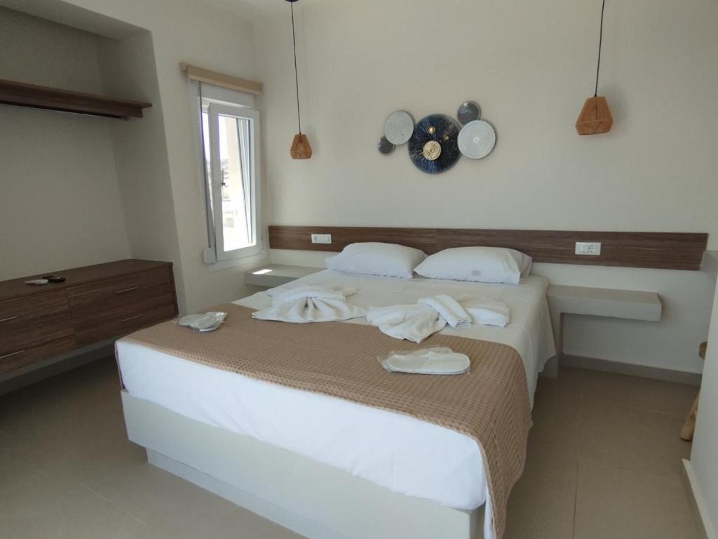 Postel nebo postele na pokoji v ubytování Tamaris Suites
