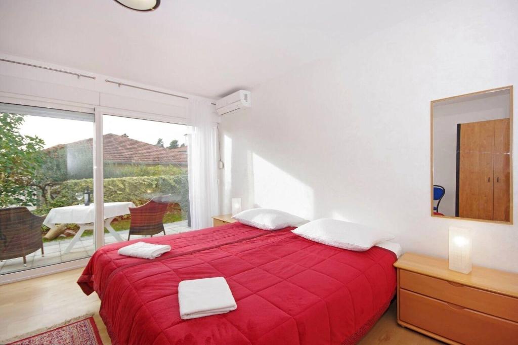 Postel nebo postele na pokoji v ubytování Apartments JaVi