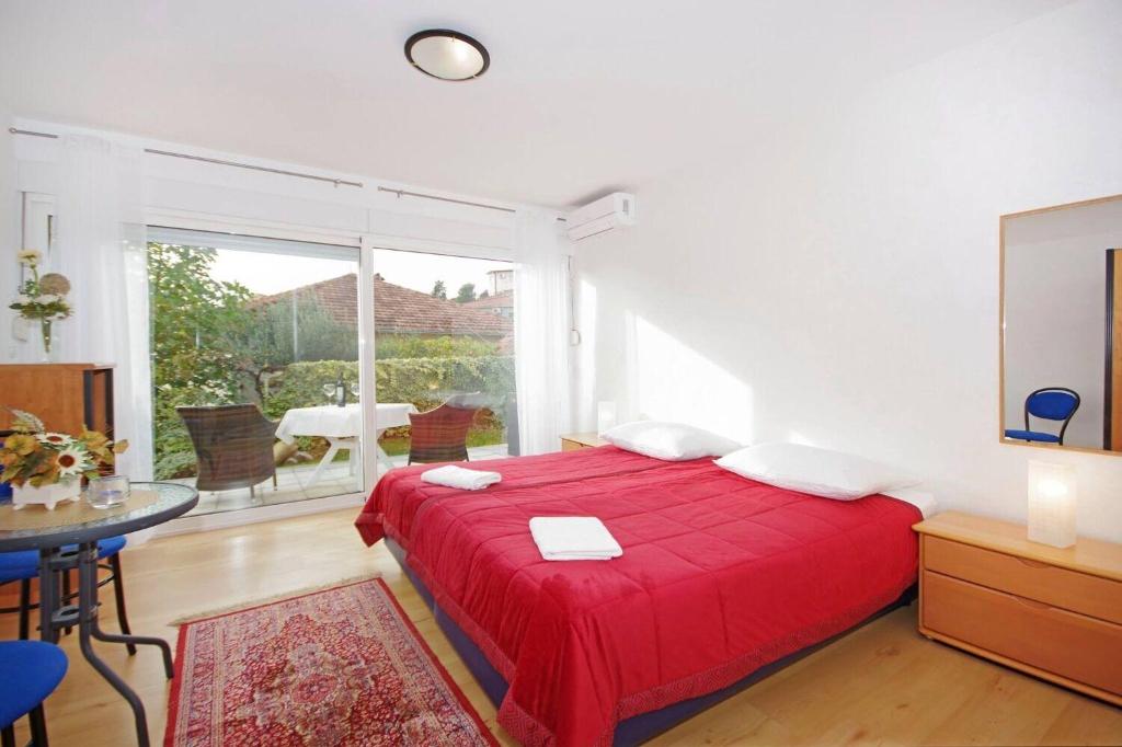 Postel nebo postele na pokoji v ubytování Apartments JaVi