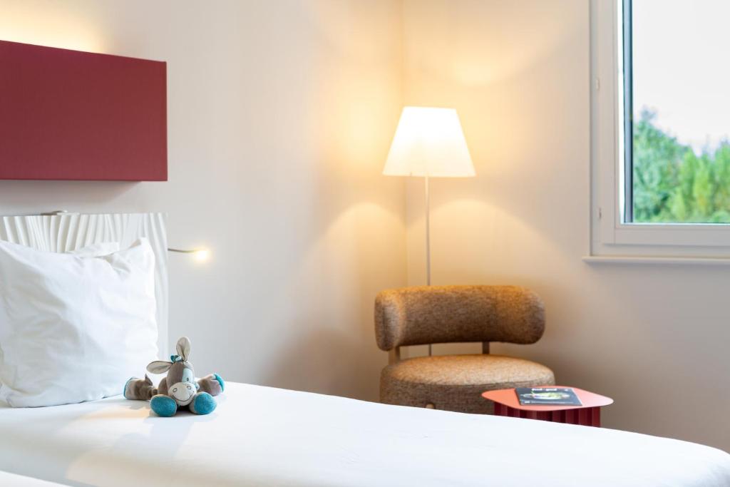 Postel nebo postele na pokoji v ubytování Hotel L'Europe