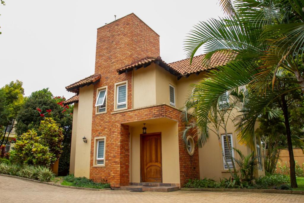 a small house with a brick at Family 3bed House in Kampala