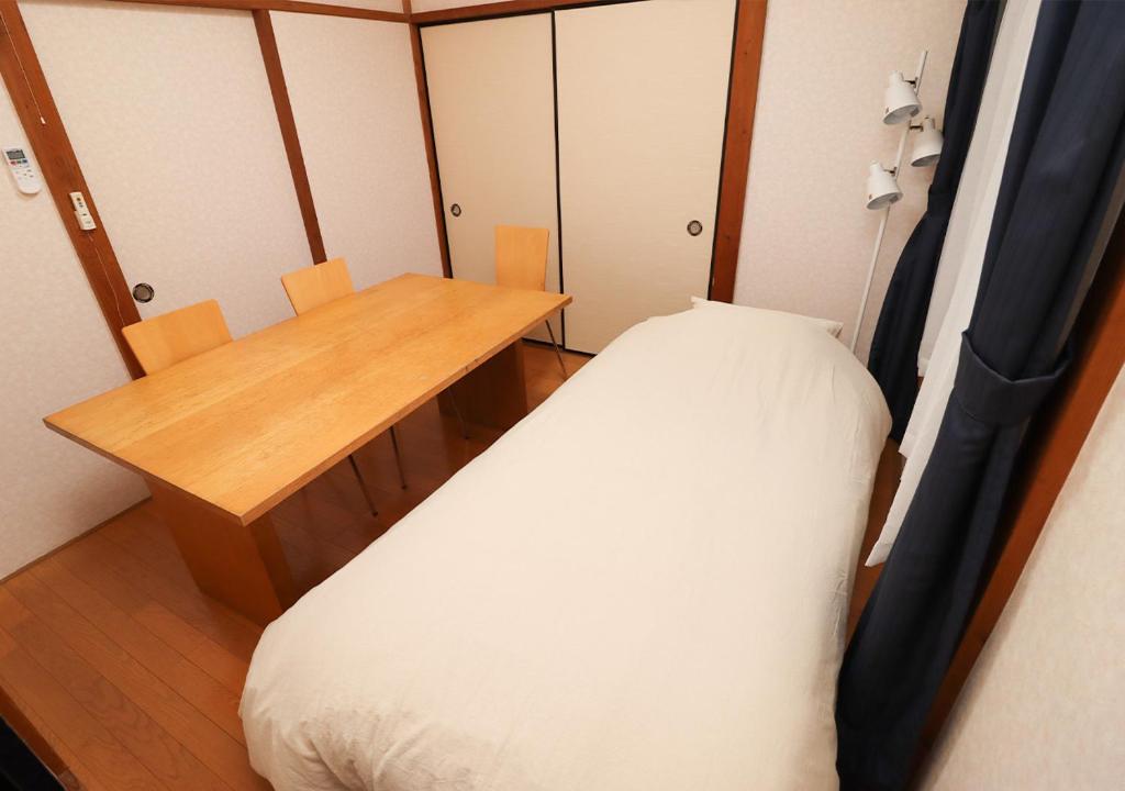Postel nebo postele na pokoji v ubytování GLOCE 南伊豆下加茂温泉ゲストハウス　
