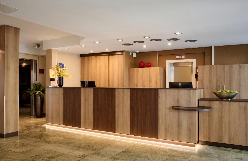 Kuchyň nebo kuchyňský kout v ubytování Leonardo Hotel & Residenz Muenchen
