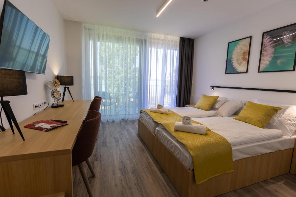 Postel nebo postele na pokoji v ubytování NEKA Village