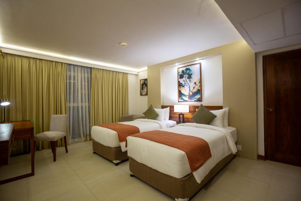 Postel nebo postele na pokoji v ubytování Pegasus Reef - A Beach Resort in Colombo