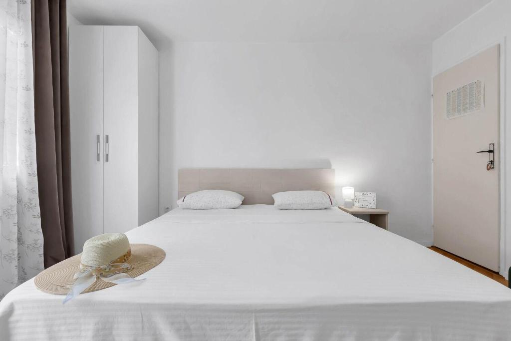 Posteľ alebo postele v izbe v ubytovaní Apartments Ivica