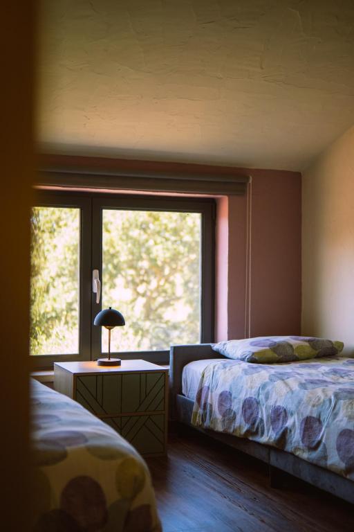 Uma cama ou camas num quarto em Quinta Japonesa