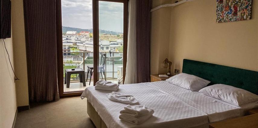 Postel nebo postele na pokoji v ubytování Aliento Hotel