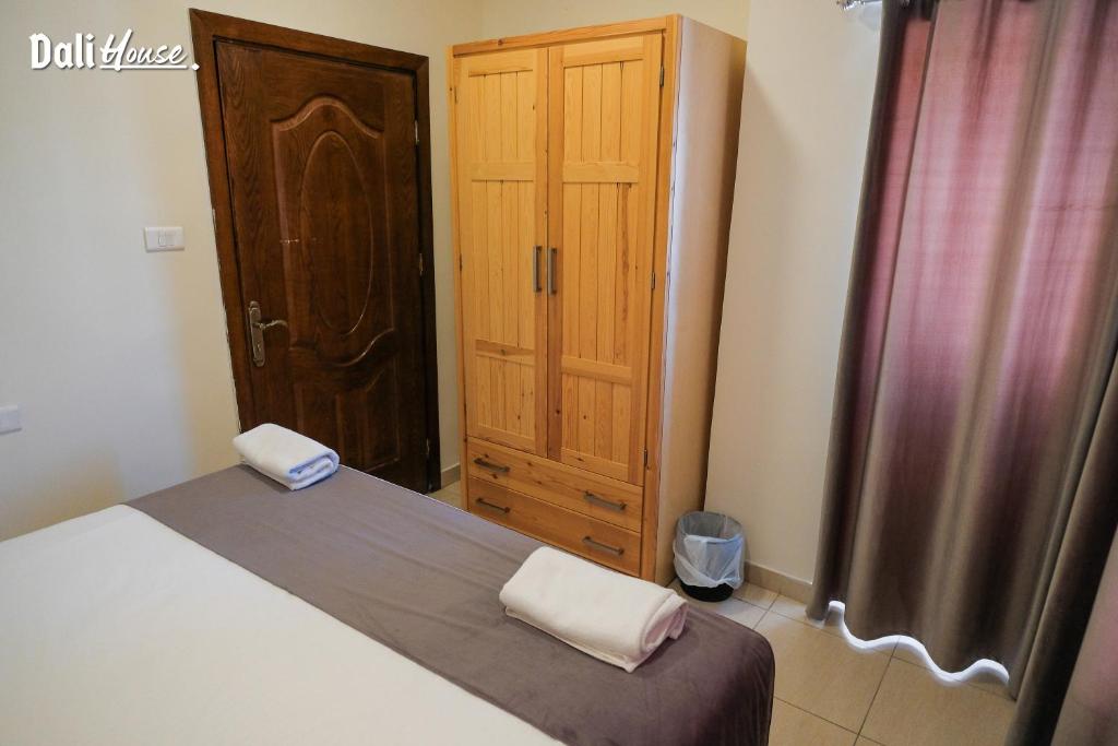 Postel nebo postele na pokoji v ubytování Dali House