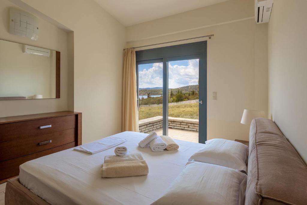 A bed or beds in a room at Nema Villa
