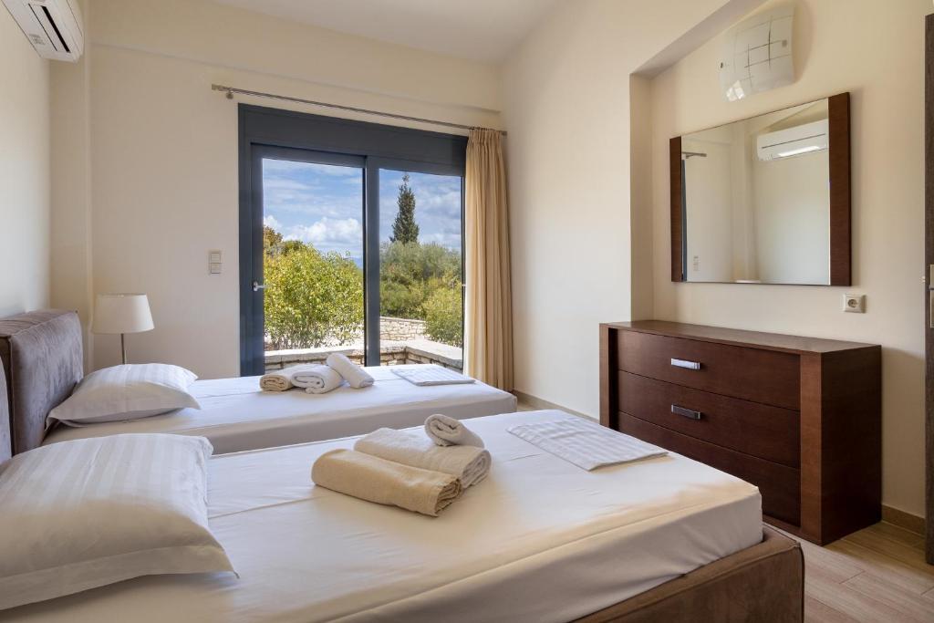 A bed or beds in a room at Nema Villa