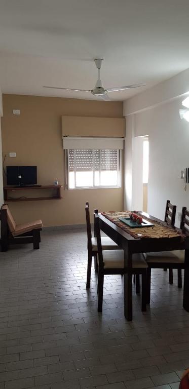 a dining room with a table and chairs at Premier in Santiago del Estero