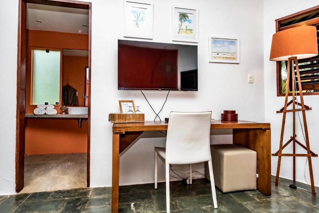 TV a/nebo společenská místnost v ubytování Pousada Côté Sud
