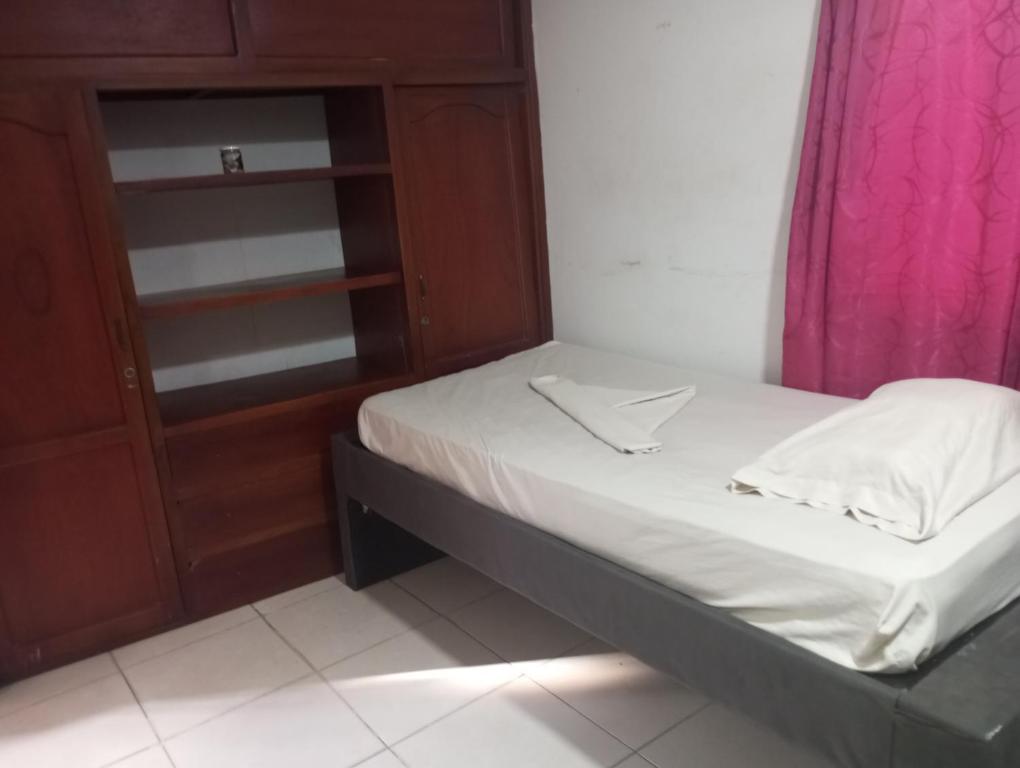 Postel nebo postele na pokoji v ubytování Nahimara Champeta Hostel