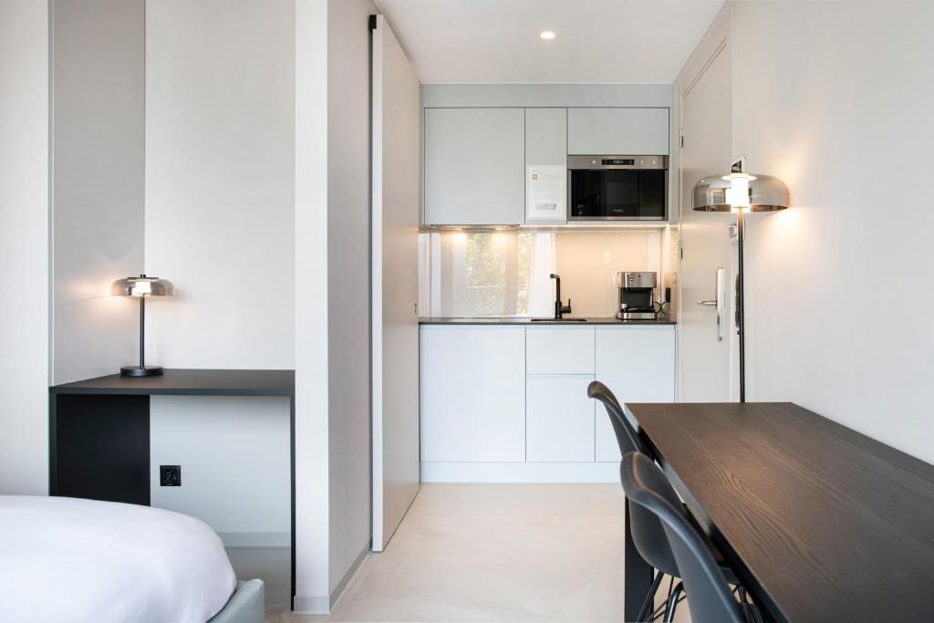 Cucina o angolo cottura di VISIONAPARTMENTS Lugano - contactless check-in