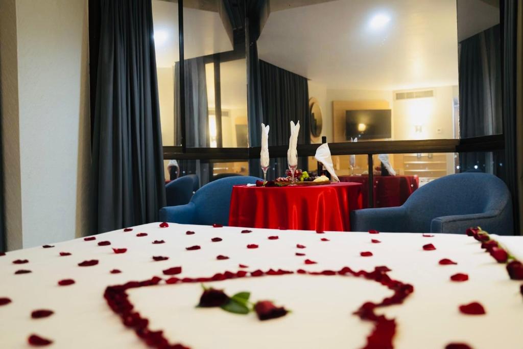 Postel nebo postele na pokoji v ubytování Hotel Real Plaza