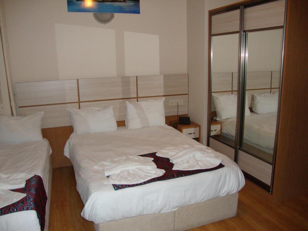 Postel nebo postele na pokoji v ubytování Royal Suites Besiktas