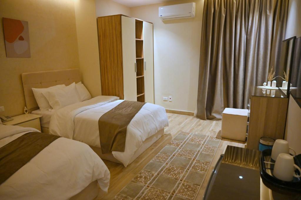 Voodi või voodid majutusasutuse Pyramids Wonders Hotel toas