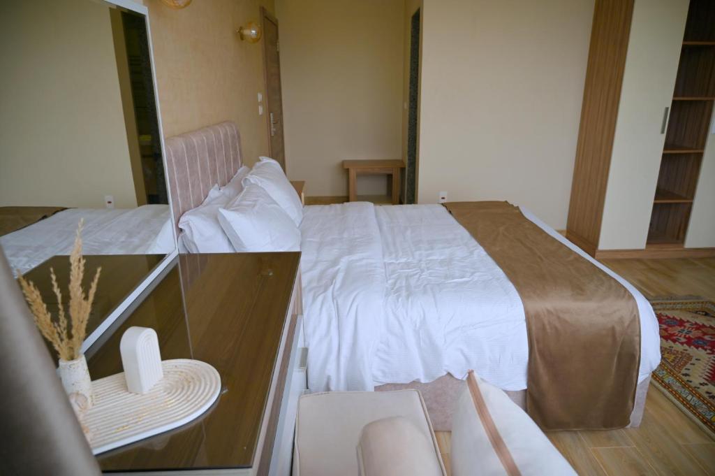 Voodi või voodid majutusasutuse Pyramids Wonders Hotel toas