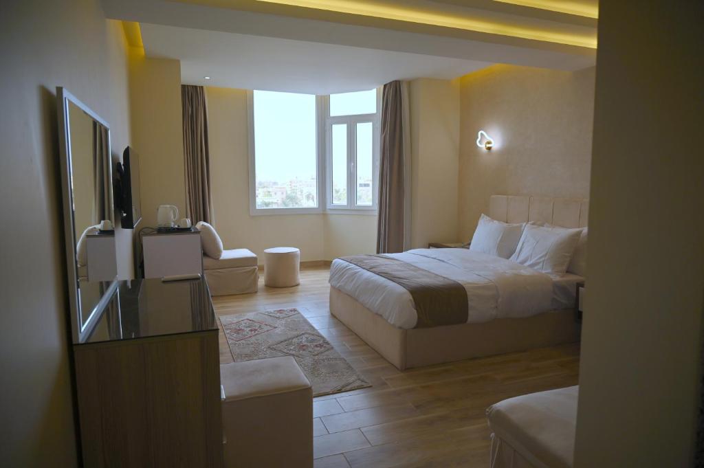 Voodi või voodid majutusasutuse Pyramids Wonders Hotel toas