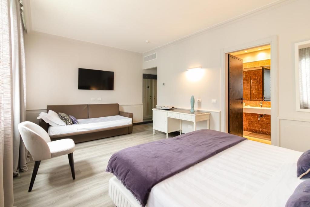 Letto o letti in una camera di Parco dei Principi Boutique Hotel