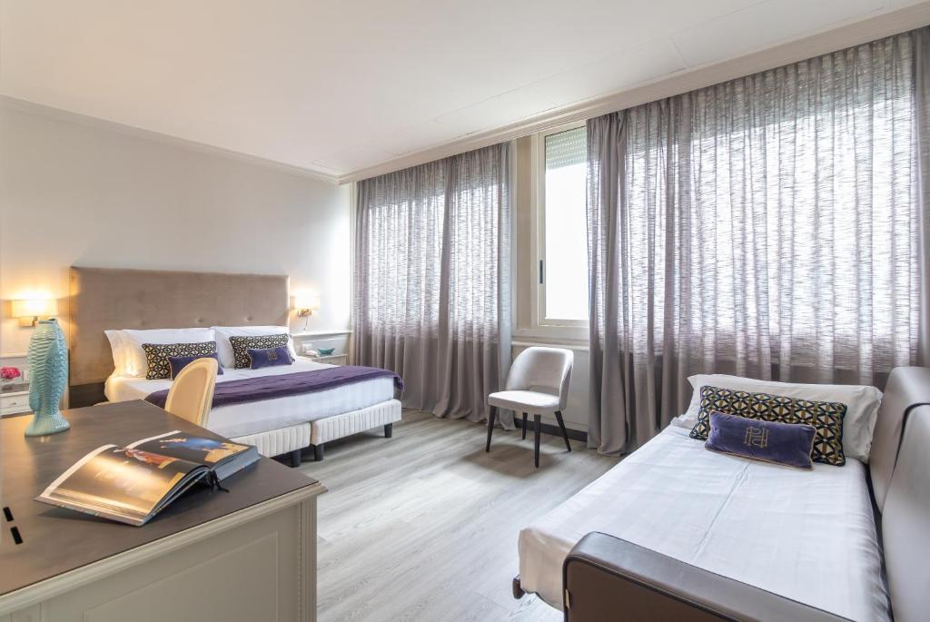 Letto o letti in una camera di Parco dei Principi Boutique Hotel